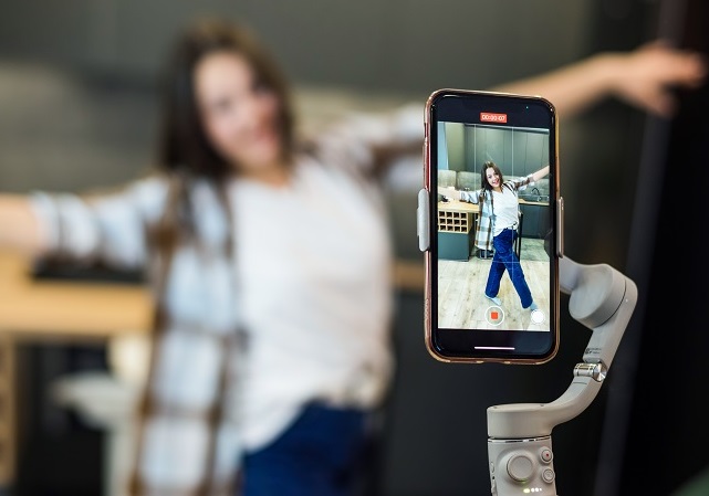 A person recording blogger influencer